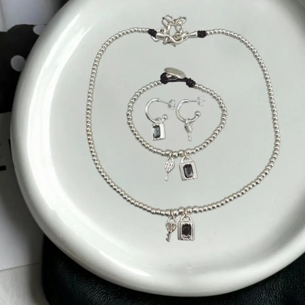 2026 Spain's dazzling socialite style irregular grey crystal lock key set jewelry three piece set surprise gift