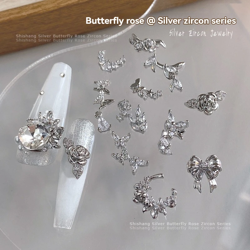 5PCS Nail Art Zircon Bowtie รูป 3D Charms โลหะเงินหรูหรา Rose ผีเสื้อโลหะอัญมณีสําหรับตกแต่งเล็บ