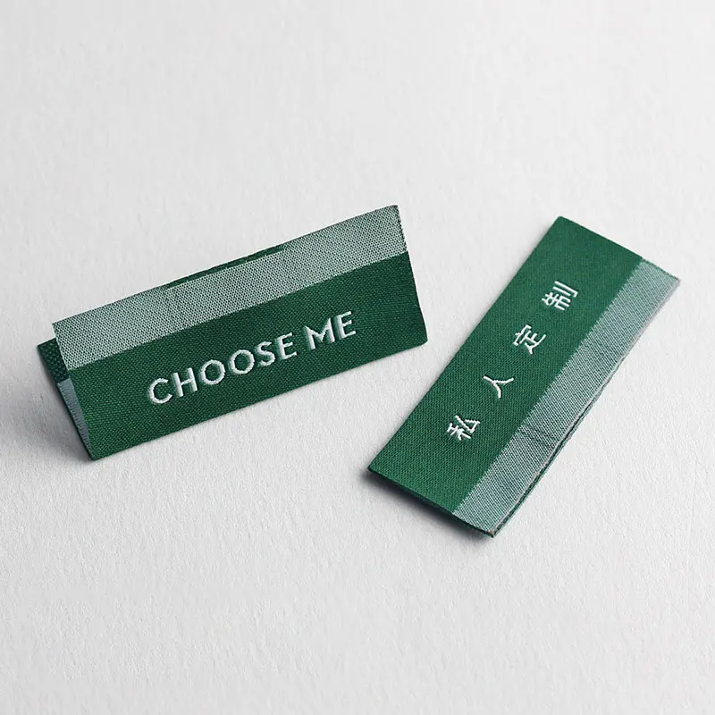 

High Quality Luxury Customization Free Design Center Fold Trademark Clothing Shuttle Fabric Label Bottom Special Texture Sewing