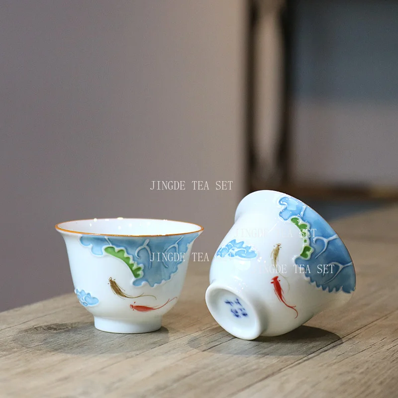 

Керамическая рельефная чайная чашка, домашняя чайная чашка с ручной росписью, белый фарфор, чайный сервиз кунг-фу, посуда для питья, главная чашка с обратным горлышком