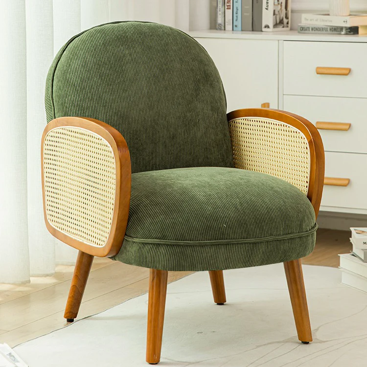 

Relax in Style with Vintage-Inspired Green Corduroy Chair Featuring Elegant Rattan Accents Perfect for Any Living Space