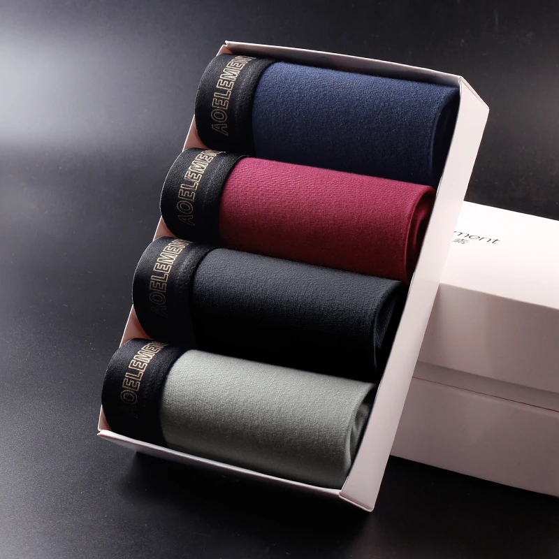 4PCS Men's thin breathable boxer shorts for spring and summer, comfortable solid color mid-rise boxers for young men.