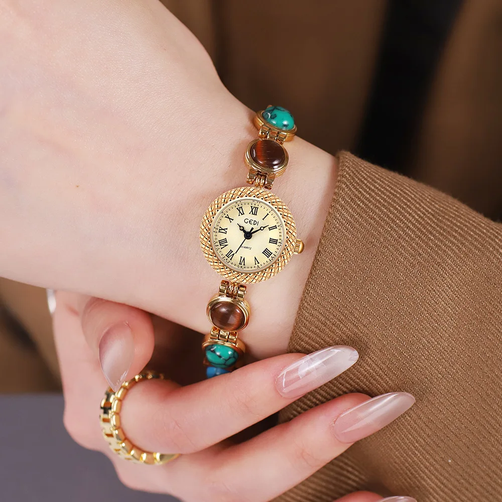 Light Luxury Rainbow Bracelet Watch Cat Eye Stone Chain Women's Watch Dress Exquisite Round Roman Scale Dial Waterproof Clock