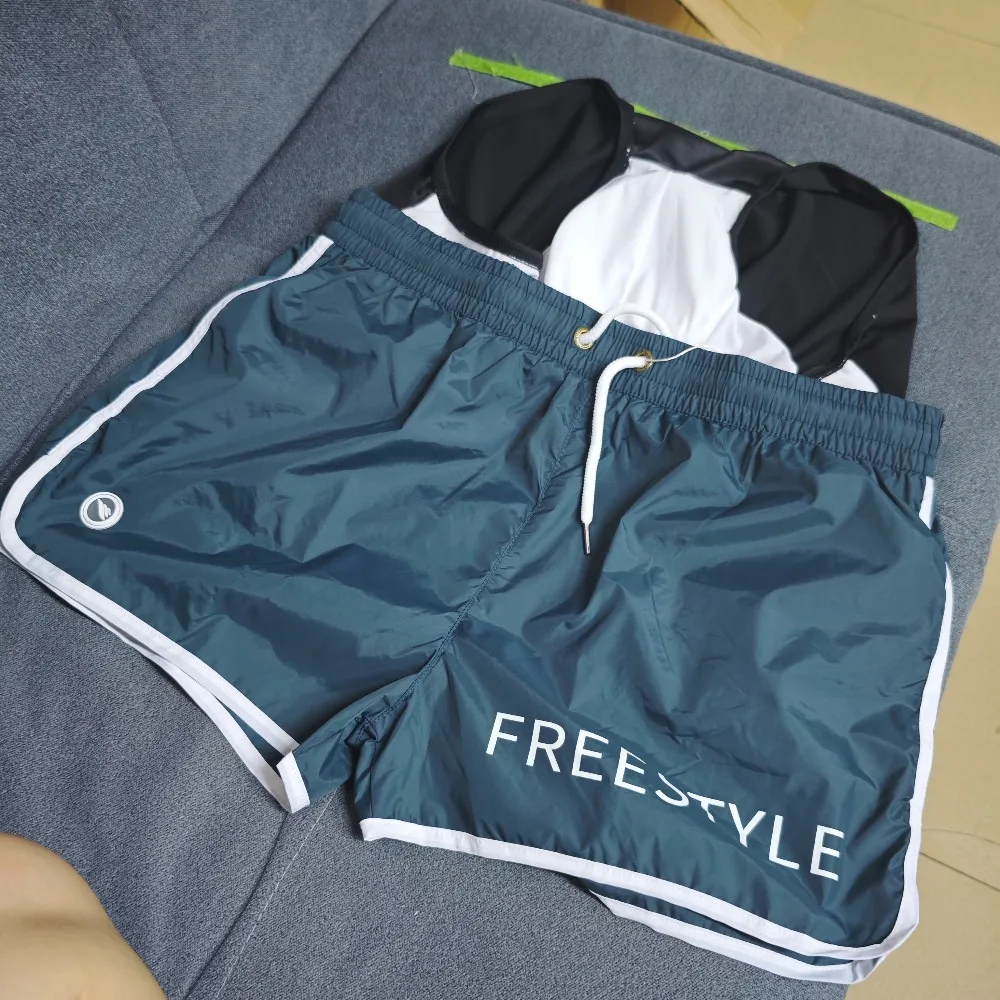 2026Wholesale swimming trunks men's loose elastic triangular lining casual three-point quick-drying men's hot spring beach ES212