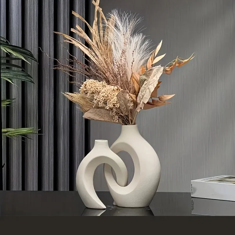 Ein hochwertiges, hohles, nordisch modernes Vasen-Set (2 Stück) für moderne Wohnraumdekoration, Kunststoff-Imitations-Hohlvase für das Wohnzimmer.