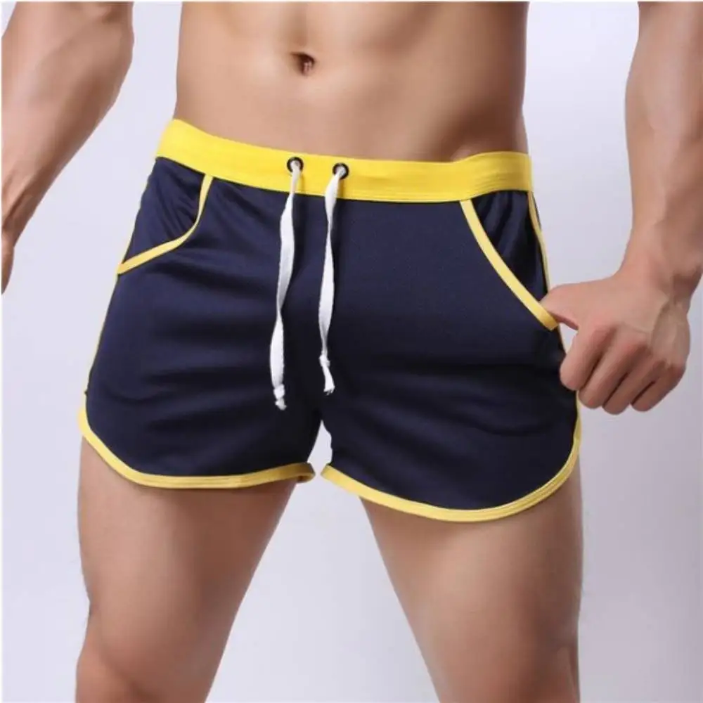 Bóxer de malla transpirable para hombre, bañador Sexy con bolsa convexa, pantalones cortos para surfear en la playa, gimnasio