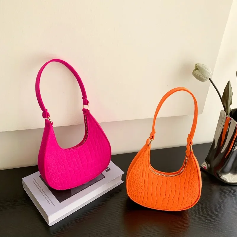 Nuevo bolso de mano de Color sólido para mujer, versión coreana de moda del nuevo bolso de hombro de ocio con patrón de piedra de verano