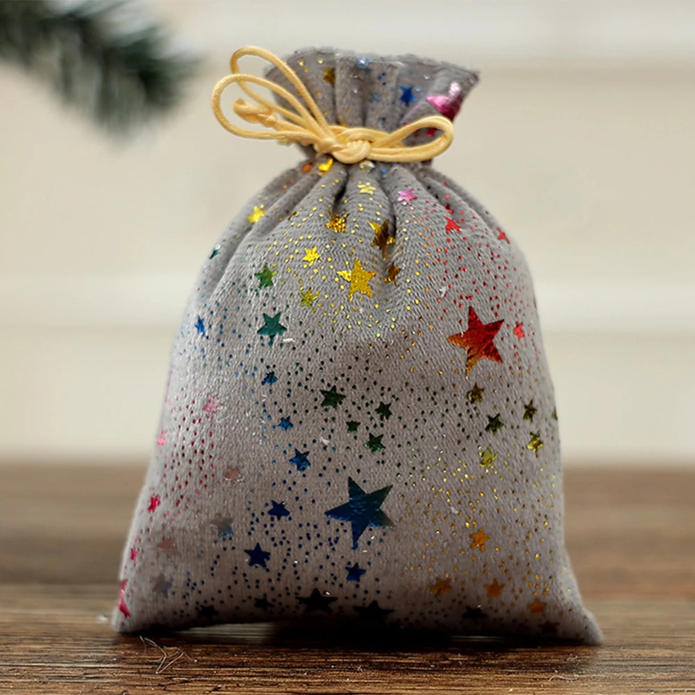 10pcs Christmas drawstring candy bags with glittering star pattern designed for holiday candy holding and party use