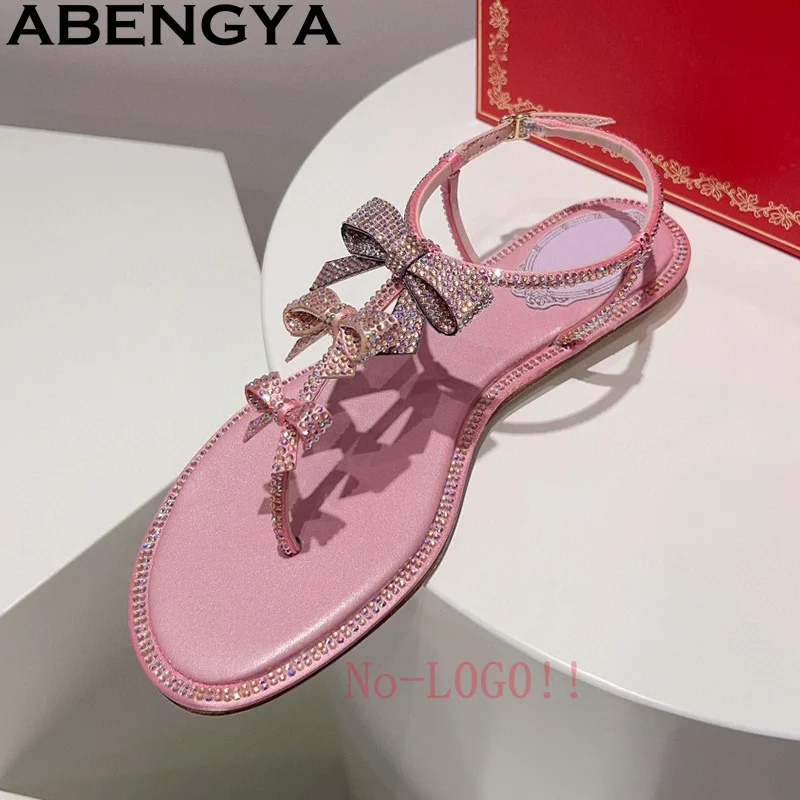 

ABENGYA, классические шлепанцы, сандалии на плоской подошве, женские дизайнерские сандалии с кристаллами и бантом, летняя повседневная пляжная обувь, zapatillas de mujer