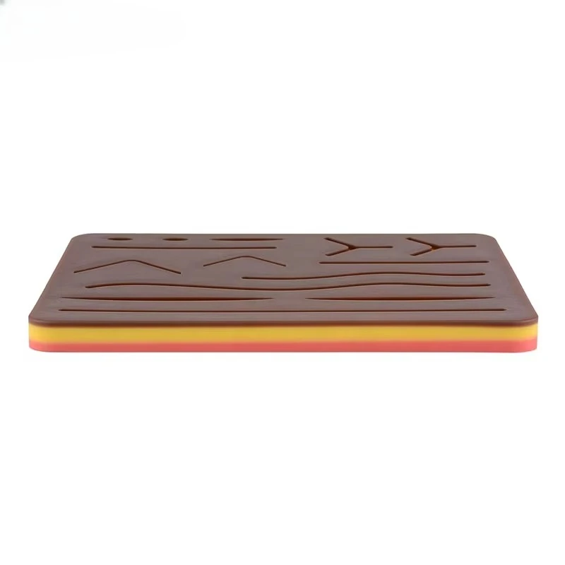 

Black suture pad for training sutures