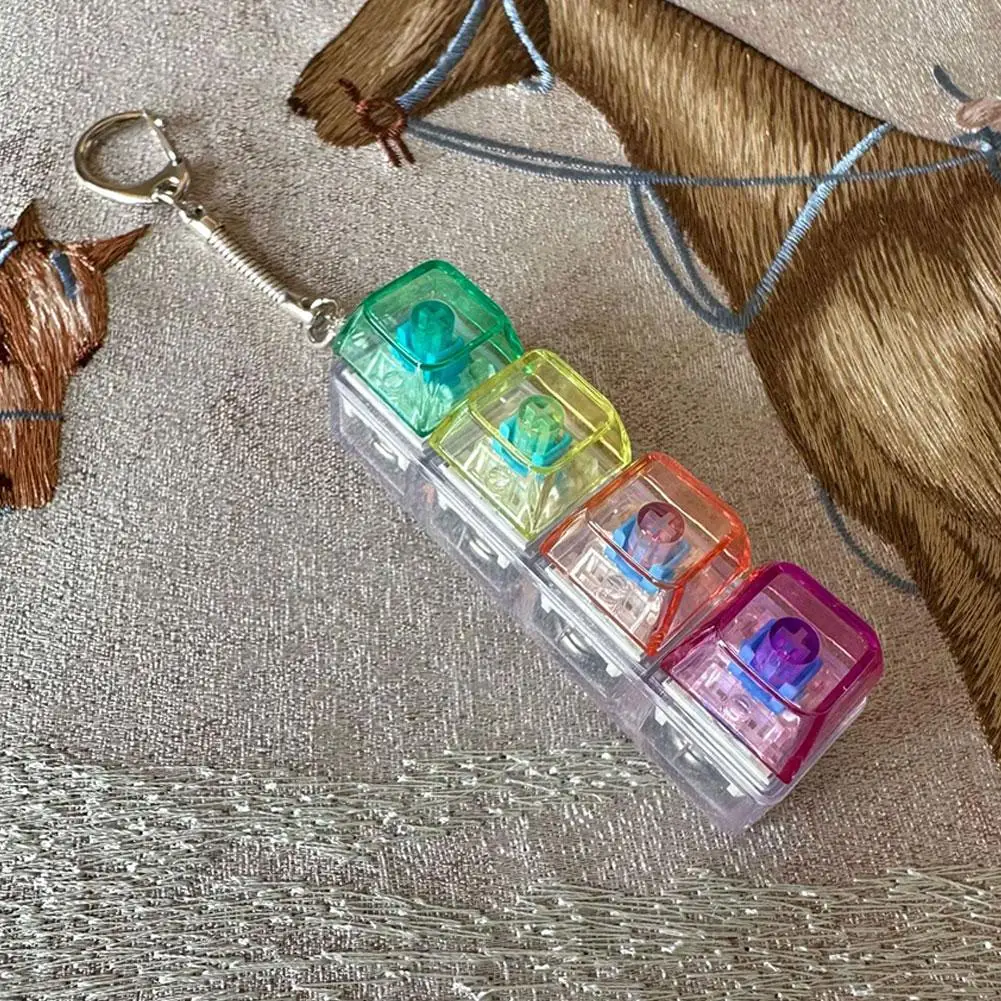 ของเล่นคลายเครียดคริสตัล 4 ปุ่ม คีย์บอร์ด LED แบบกลไก พวงกุญแจ ของเล่นนิ้วมือ แกดเจ็ตคลายความเครียด สำหรับผู้ใหญ่