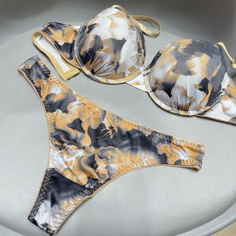 Graffiti stampati lucidi alla moda Set di reggiseno perizoma per biancheria intima per il commercio estero transfrontaliero europeo e americano