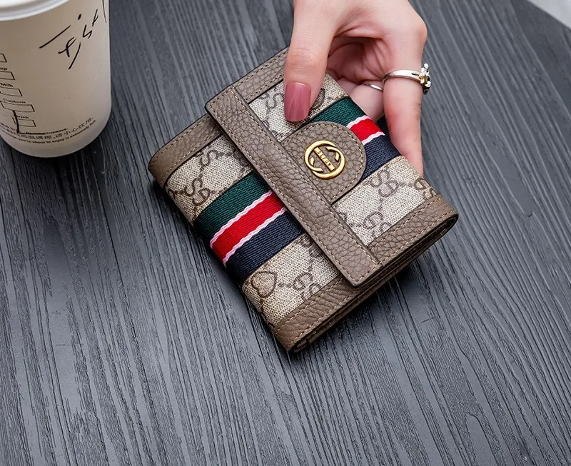 women‘s New folding wallet light luxury design Genuine Leather wallet zero wallet buckle three fold simple design