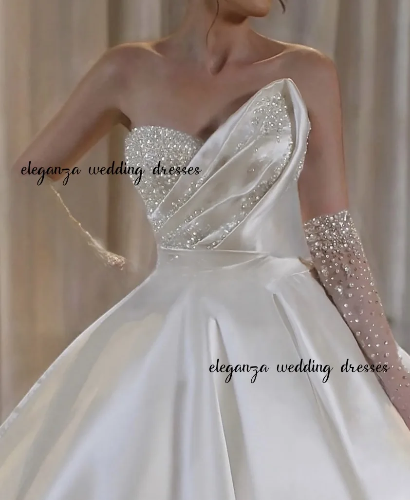 فستان زفاف فاخر مخصص لؤلؤي على شكل قلب بياقة على شكل قلب بدون أكمام من الساتان منتفخ تنورة فستان الزفاف vestidos de novia 2025