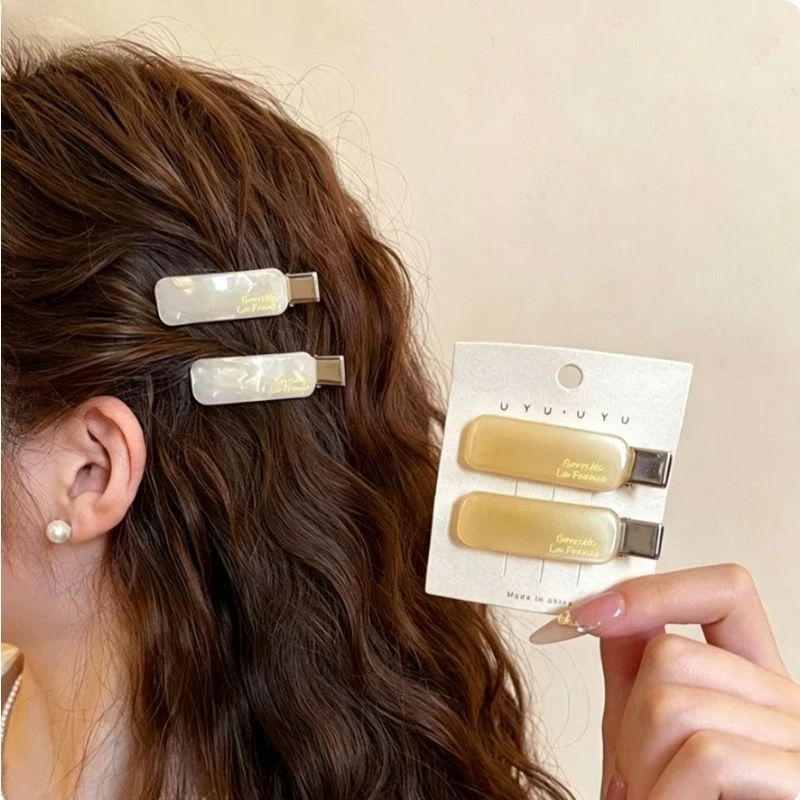 

French-style hair clips with a textured finish, duckbill clips for side-swept bangs, hairpins and hair accessories for summer