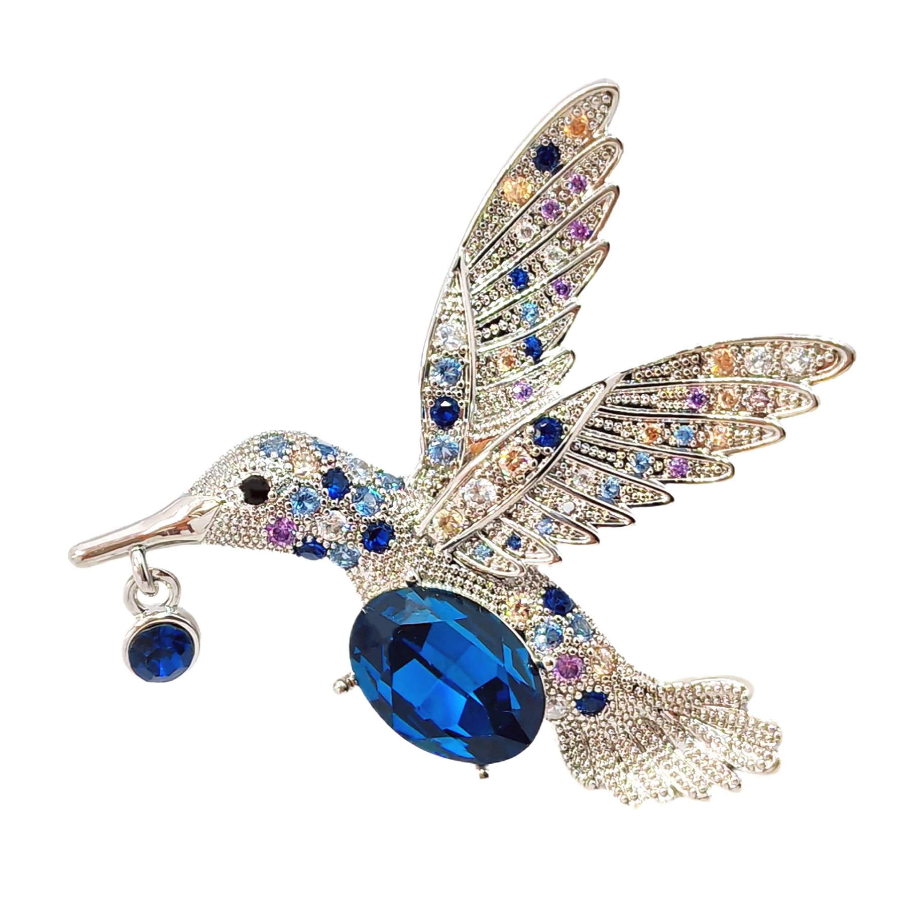 

Flying Hummingbird Brooch with Blue Belly and Wings Adorned with Simulated Zircon – Beak Holding Blue Simulated Gemstone