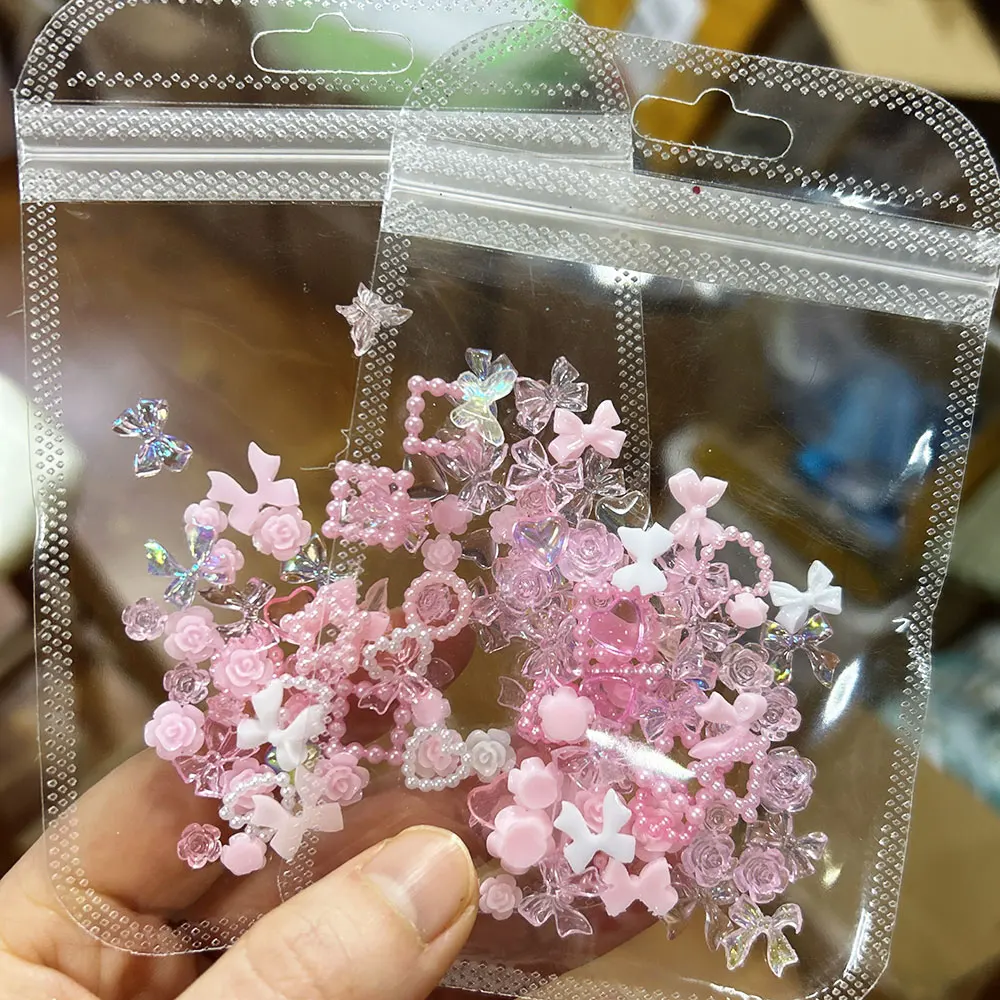 50/100pcs 3D Kawaii Pink White Bow/Flower Nail Art Charms Pearl Star Heart , Aurora Ribbon Nail Rhinestones Resin Nail Craft Dec