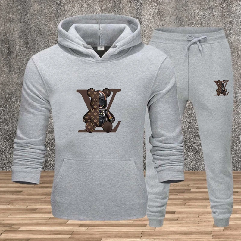 Un set da due pezzi da uomo alla moda per l'autunno e l'inverno con cappuccio e pantaloni sportivi caldi per fare jogging, fitness e abbigliamento casual