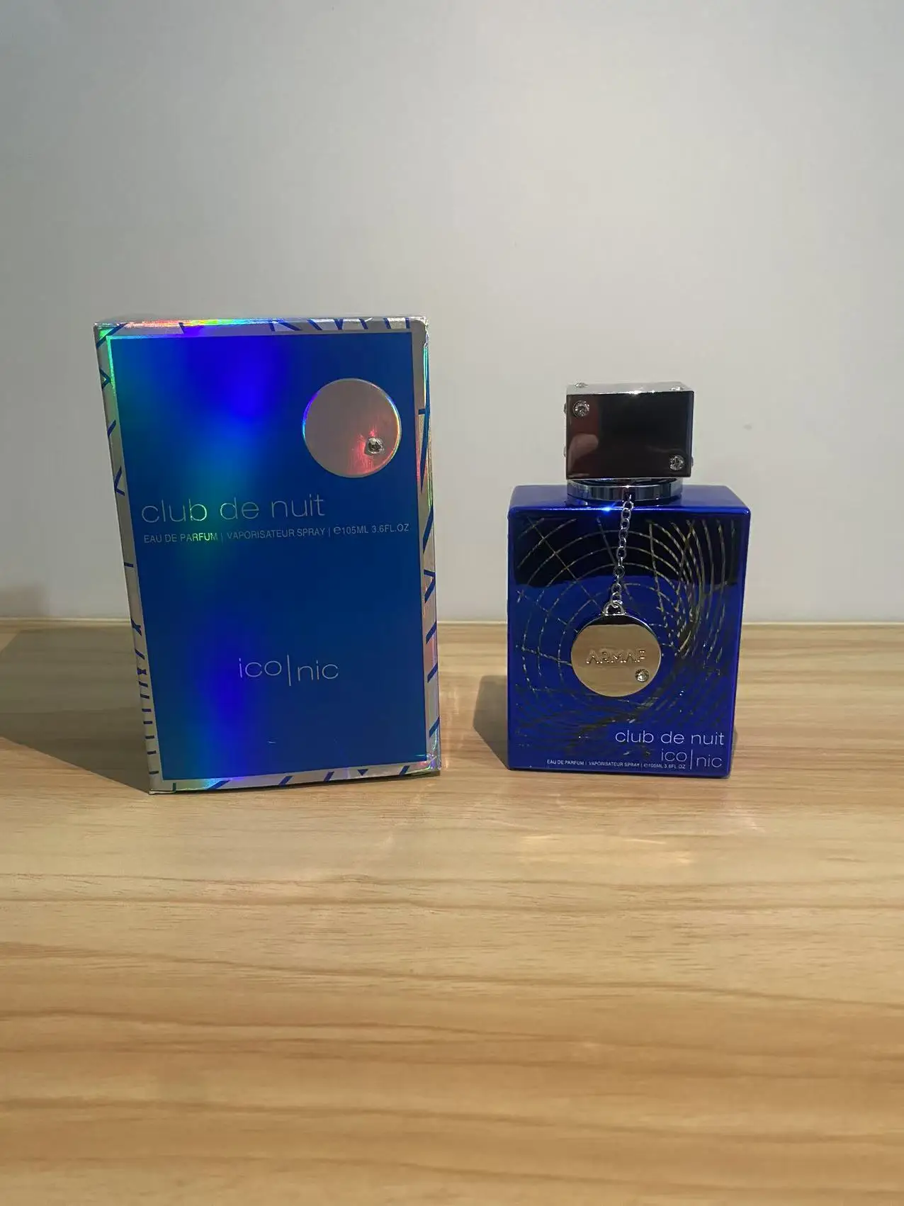

Club de Nuit Xclusive Iconic Eau de Parfum: Royal Blue Bottle, Silver Pendant Design for Men