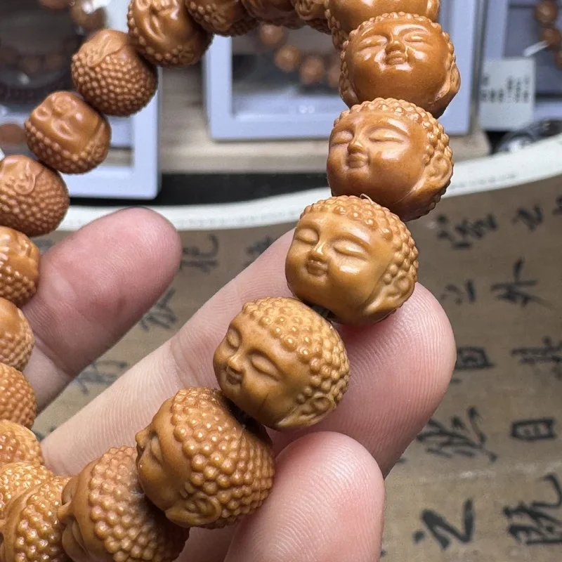 Hand-carved , baby Buddha monkey head walnut bracelet, Beijing-style eight-sided peach-shaped beads magic bea