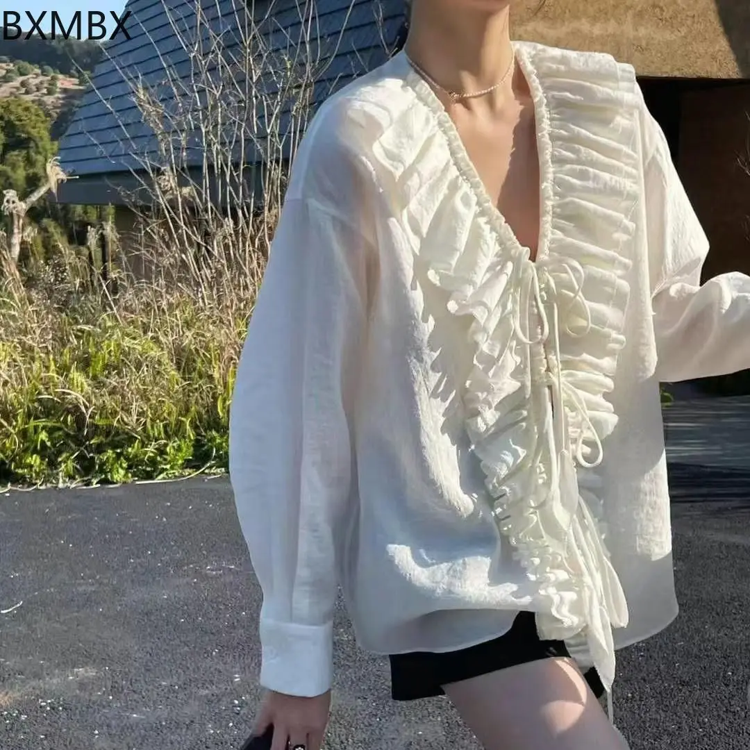 

French fairy feeling multi-layer pleated ruffle edge long-sleeved shirt European spring series V-neck loose versatile top