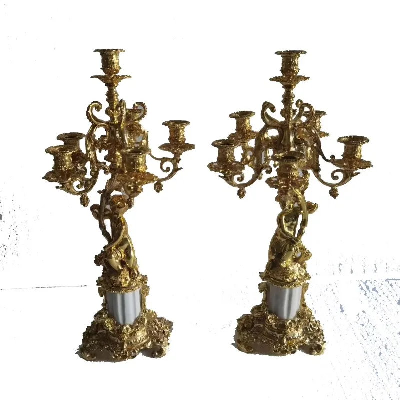 A pair of Rococo-style gold-plated bronze Cupid statues, brass Olmo copper alloy and marble candlesticks, 5 candle arms