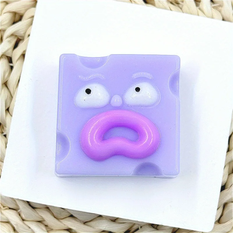 Giocattolo da spremere quadrato con bocca di salsiccia eccentrica - Giocattolo di scherzo antistress TPR in rosa, giallo, blu, verde con espressione facciale unica