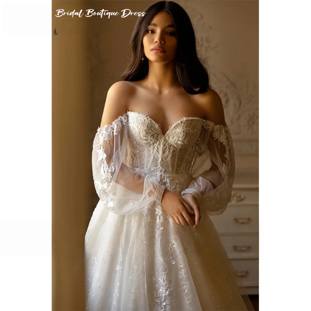 カスタマイズされたエレガントなAラインのウェディングドレスビーズレースアップリケ花嫁恋人バックレスパフスリーブプリンセスブライダルドレストレーン