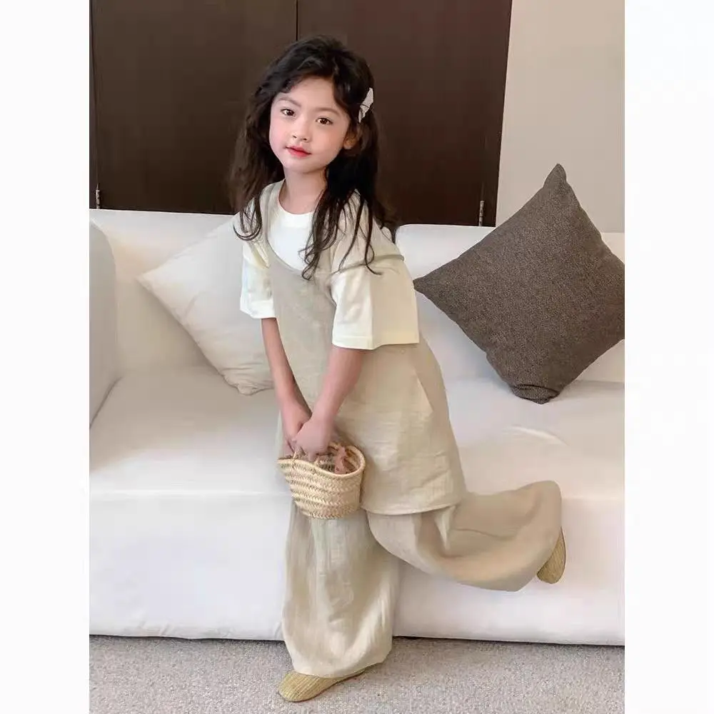 

Girls Summer Casual Loose and Popular Three Piece Set 2026 New Solid Color Western-Style Short Sleeved Suspender Pants Set