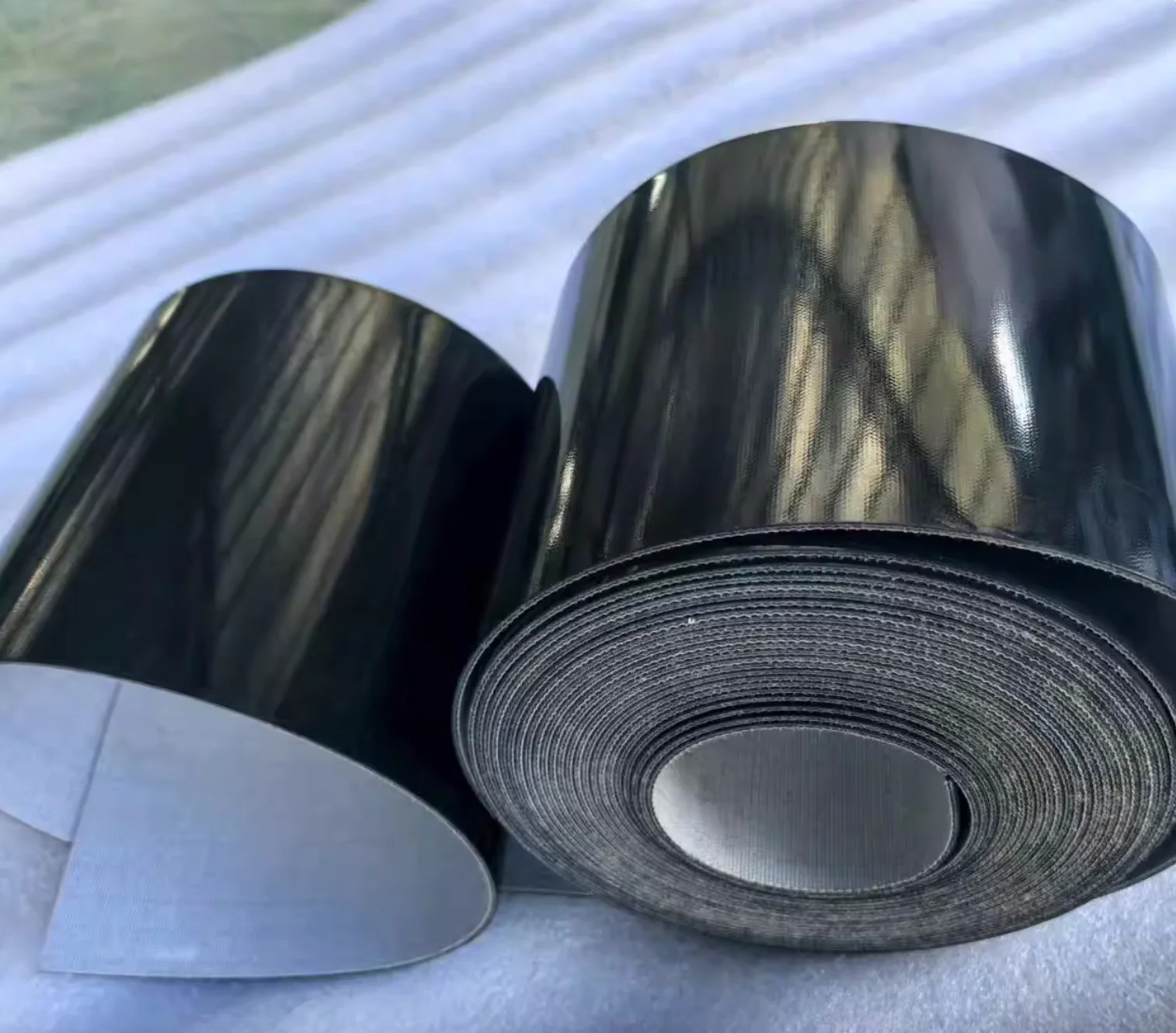 

2шт по периметру: 1280x40x1мм черная конвейерная лента из ПВХ