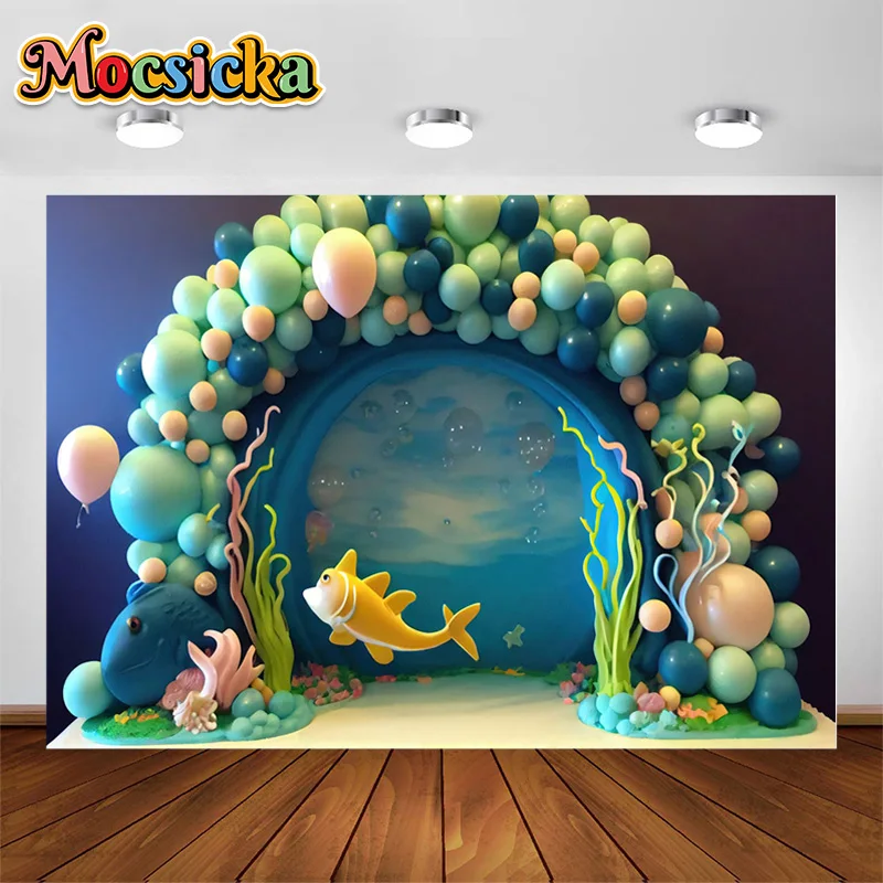 

Ocean Theme Photography Background Golden Yellow Fish Swimming Through Green Balloon Arch Surrounded By Water Plants Backdrop