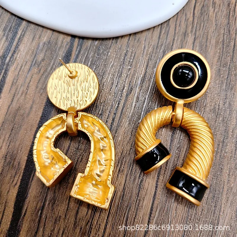 Electroplated gold retro, exaggerated design earrings