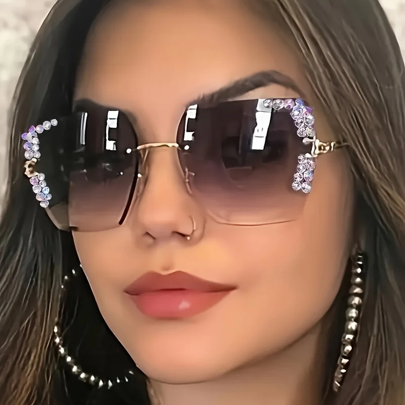 

A pair of fashionable women's square frameless gradient lens glasses with crystal decoration and metal material