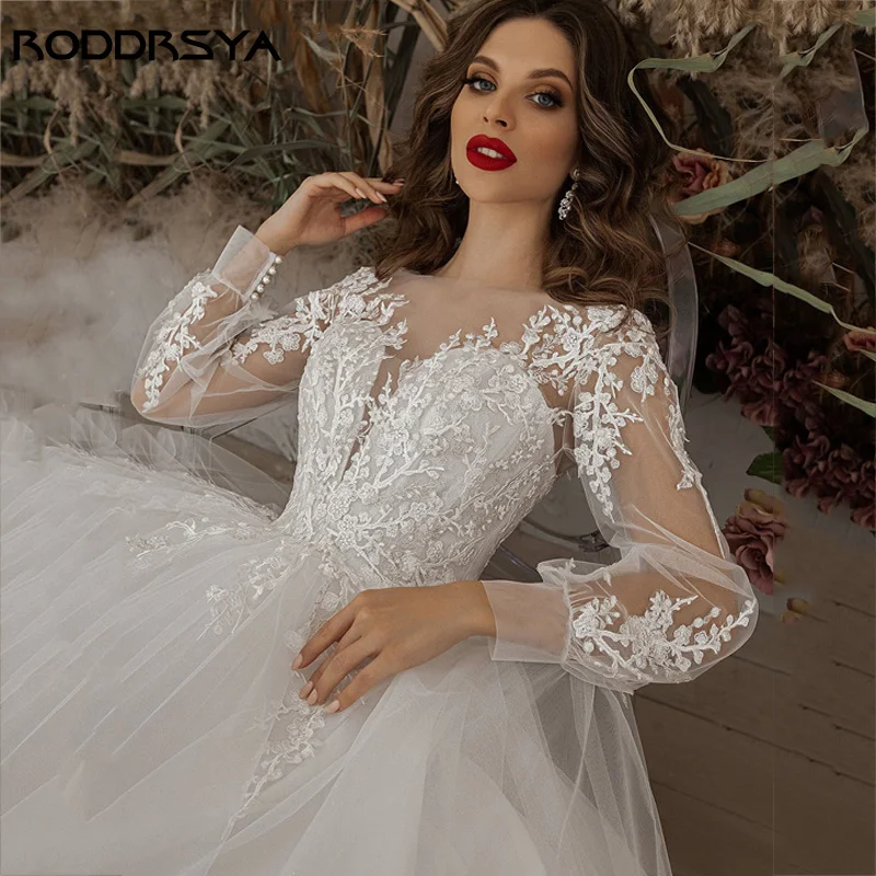 RODDRSYA فساتين زفاف عاجية أكمام طويلة مزين بالدانتيل مغرفة رقبة خط تول-فستان عروس بوهو vestido de noiva BeachRoddrsya عاج عرس ثوب كم طويل Appliques رباط عنق مستدير حرف واحد فقط ثوب الزفاف بوهيميا 2024 شاطئ أسود