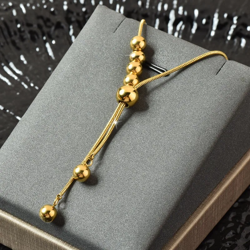 

Titanium steel necklace for women's autumn and winter, a long and personalized pull-out steel ball tassel necklace