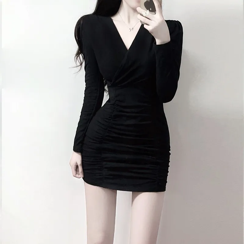 Black V-neck tight fitting lady style dress that looks slimmer  with a buttocks wrapped inside and a bottom skirt