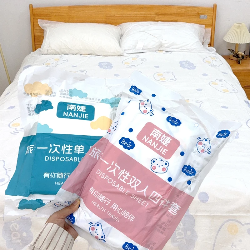 Juego de sábanas desechables no tejidas, juego de cama grueso, sábanas portátiles de 3/4 Uds., suministros de seguridad impermeables para acampar y Hotel, 1/3