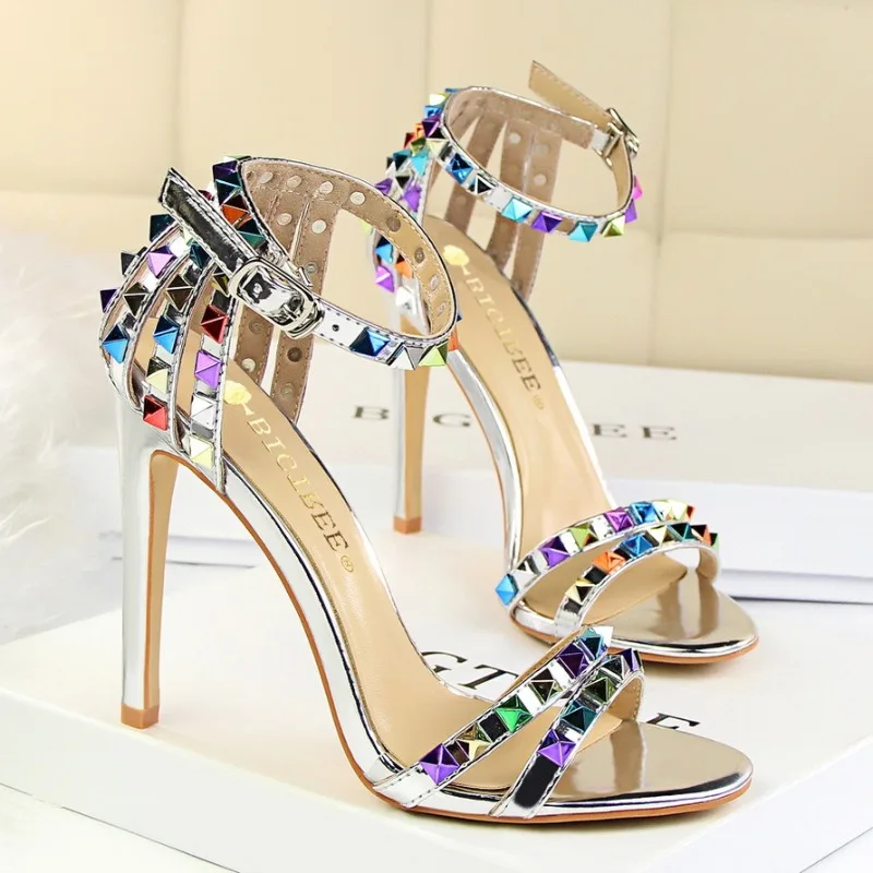 Roman Style Women's Shoes with Thin Heels, Super High Heels, Exposed Toes, a Straight Cut with Hollowed Out Colored Rivets Sanda