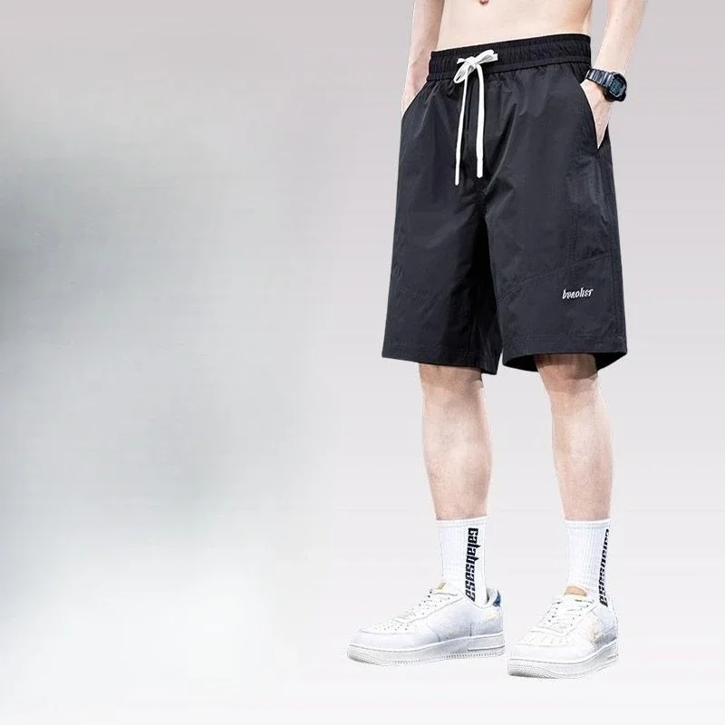 Celana Pendek Kargo Pria Panjang Solid Bermuda dengan Tali Tarik Celana Pendek Pinggang Setengah Elastis Longgar Lebar untuk Pria Desainer Saku