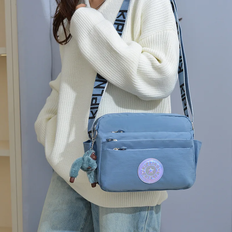 

2025 UrbanPrimate Sling Bag - StormShield Nylon Crossbody Lightweight Purse Geometric Ape Charm Anti-Splash Shopping Carry