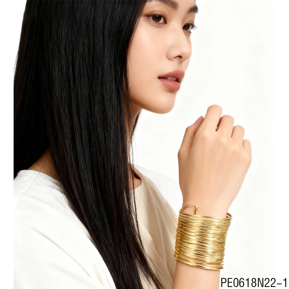 PESENAR  This Is a Gold Layered Open Bracelet Constructed with Multiple Turns of Wire Suitable for the Pharaonic Party