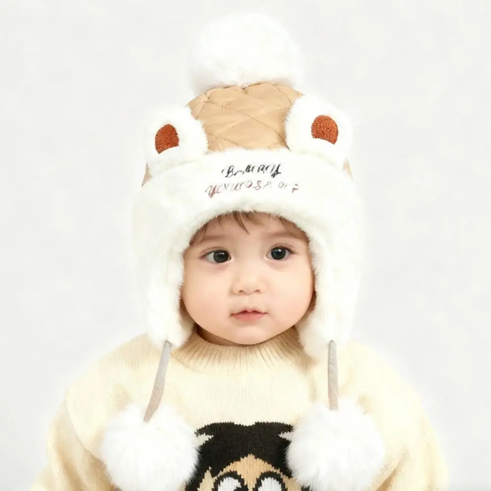 Nieuwe warme winterbabymuts met bont gevoerde winddichte oorbeschermingshoeden met baloorflap