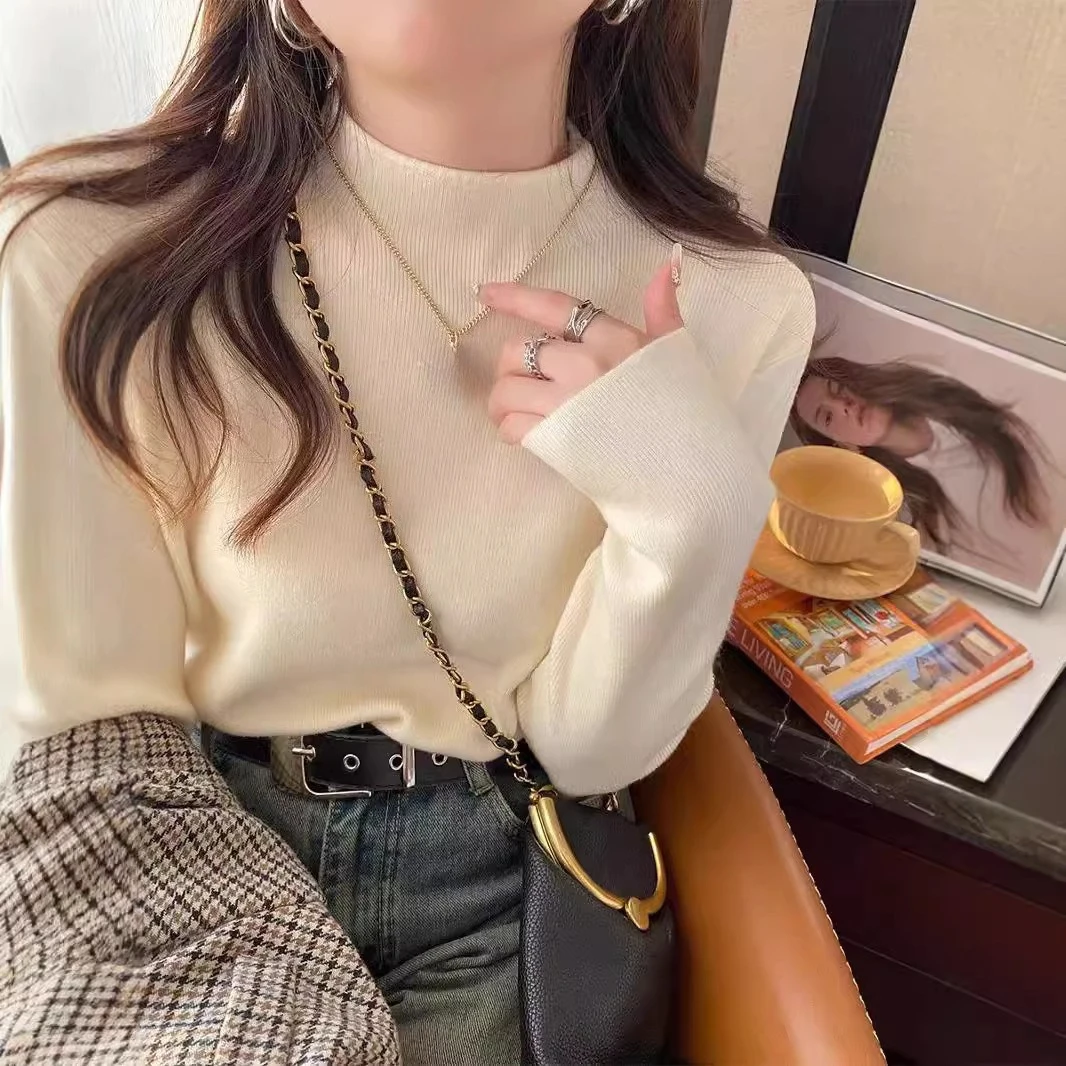 Nueva moda mujer Color sólido Simple básico suelto Casual moda medio cuello alto manga larga suéteres de punto camiseta interior femenina