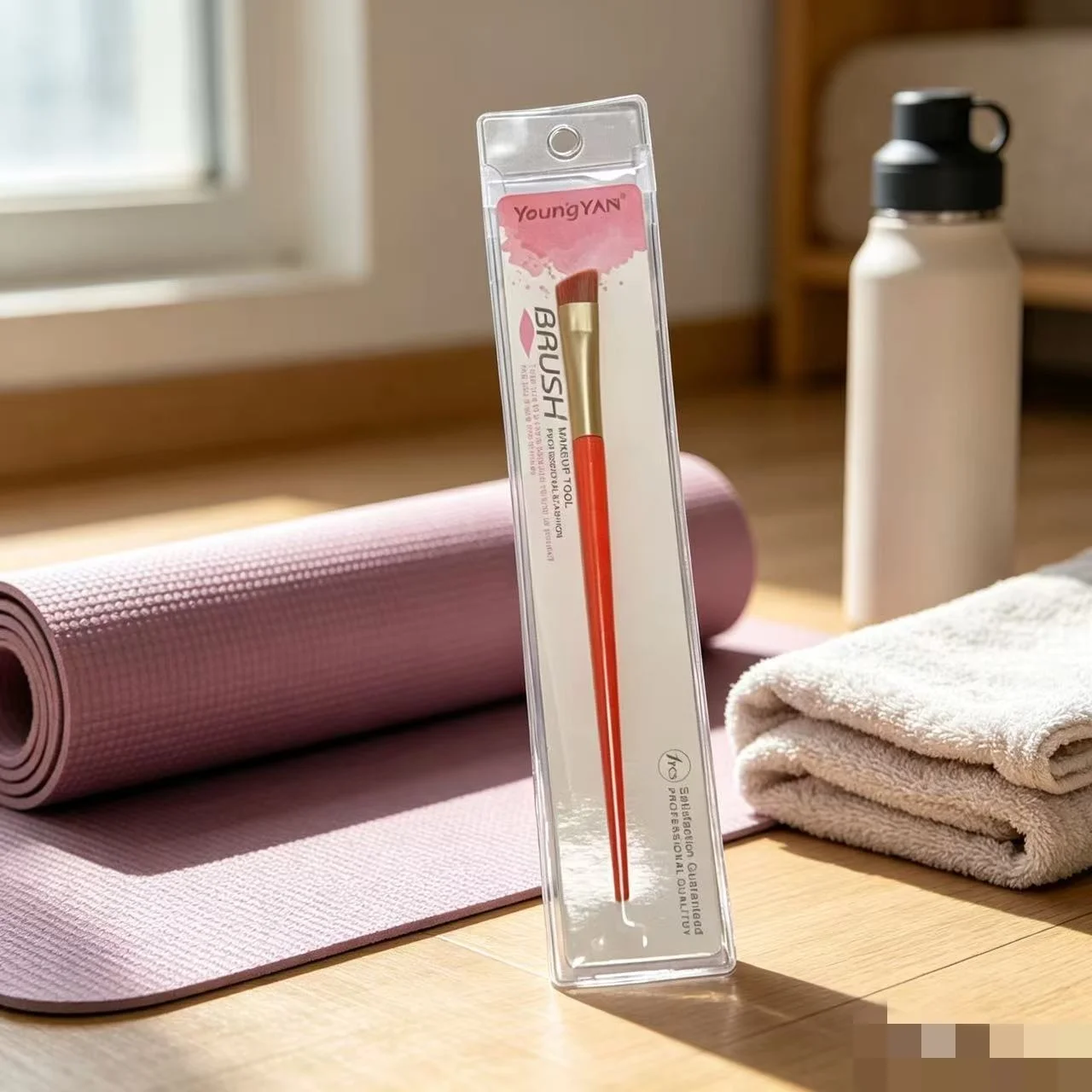 A single, flat-headed professional eyebrow brush with soft, densely packed bristles and strong powder-grabbing capabilities.