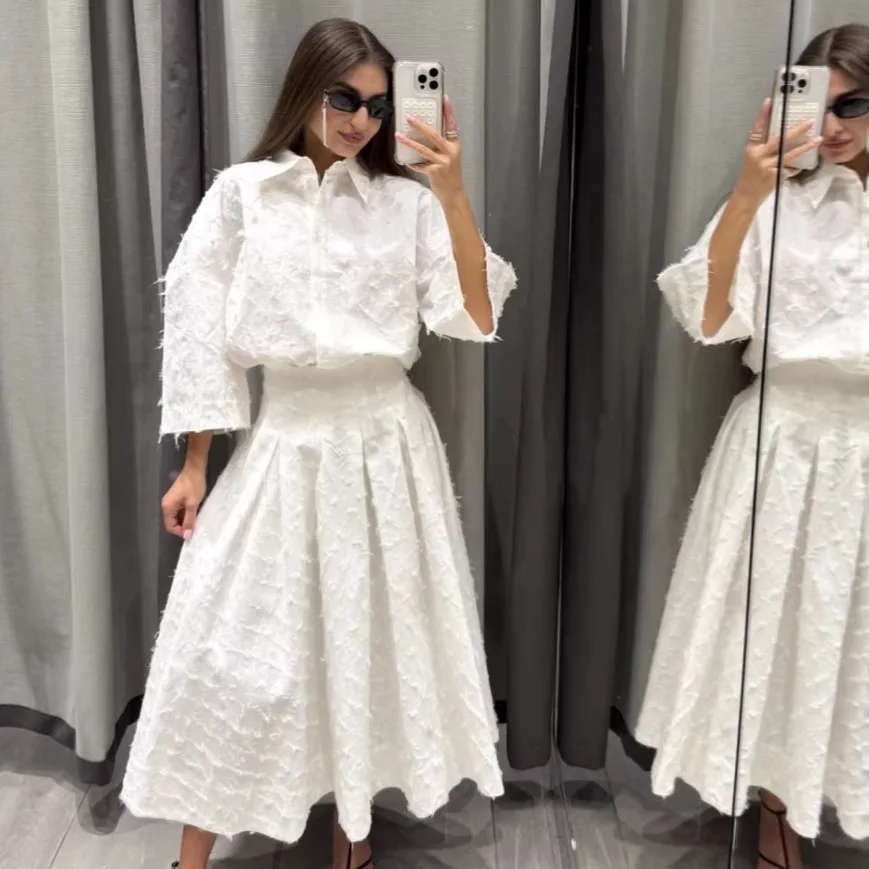 

European and American women's popular temperament tassel feather shirt + skirt set