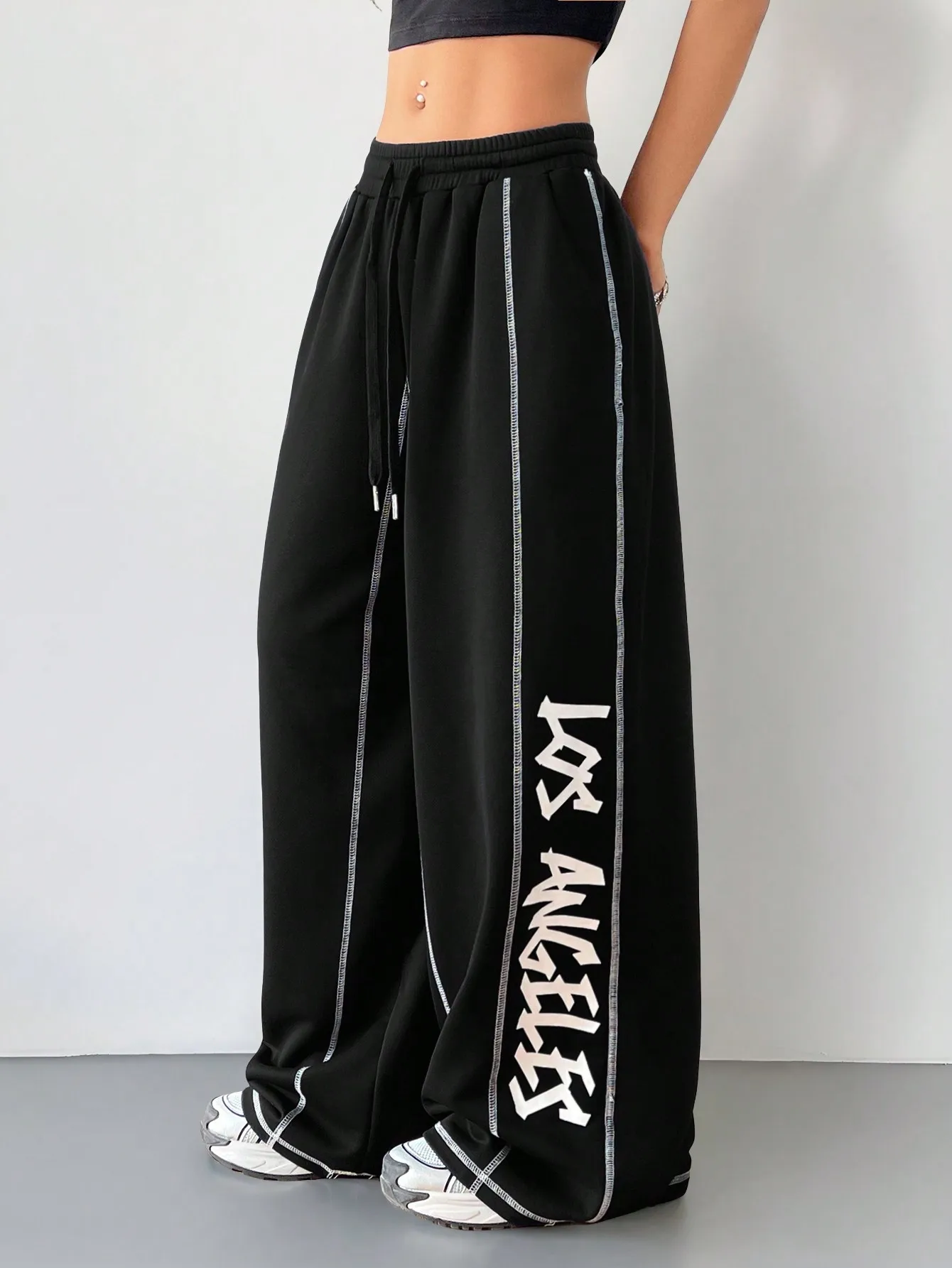 

Women's Wide Leg Sweatpants with Contrast Piping and Bold Letter Graphic