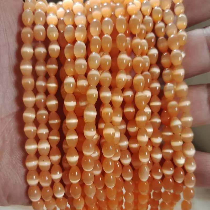 Cuentas con forma de arroz de ojo de gato de 5x7mm, tamaño del agujero de 1,0mm, ojo de gato de grado A áspero, alrededor de 57 piezas por hebra para uso en joyería de moda