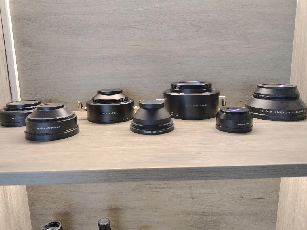 Pezzi di ricambio per apparecchiature Lente di messa a fuoco Lunghezza d'onda 355nm F-theta Lente di messa a fuoco UV Prezzo Lente da campo in fibra per pennarello UV