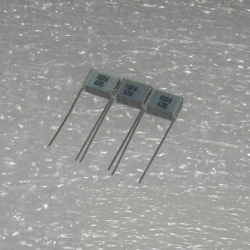 10/50PCS New original 630V 0.01UF 103K P-7.5 laminated multi-layer cake film capacitor 7.5*3*5MM P=5MM