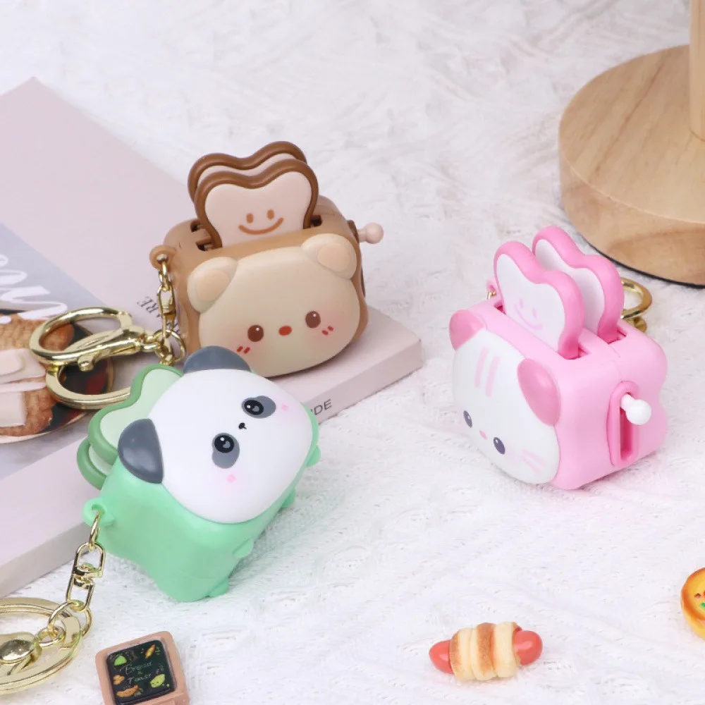 Cartoon animal-shaped fun hand-cranked toast pendant, student bag decoration, stress-relief toaster keychain, bag accessory image 2